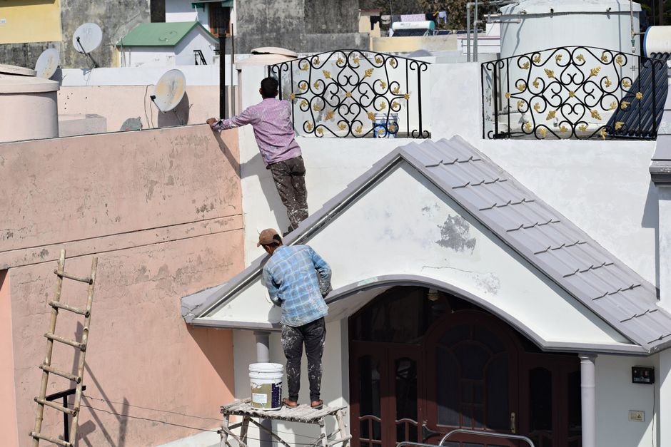 Two painters at work on a renovation